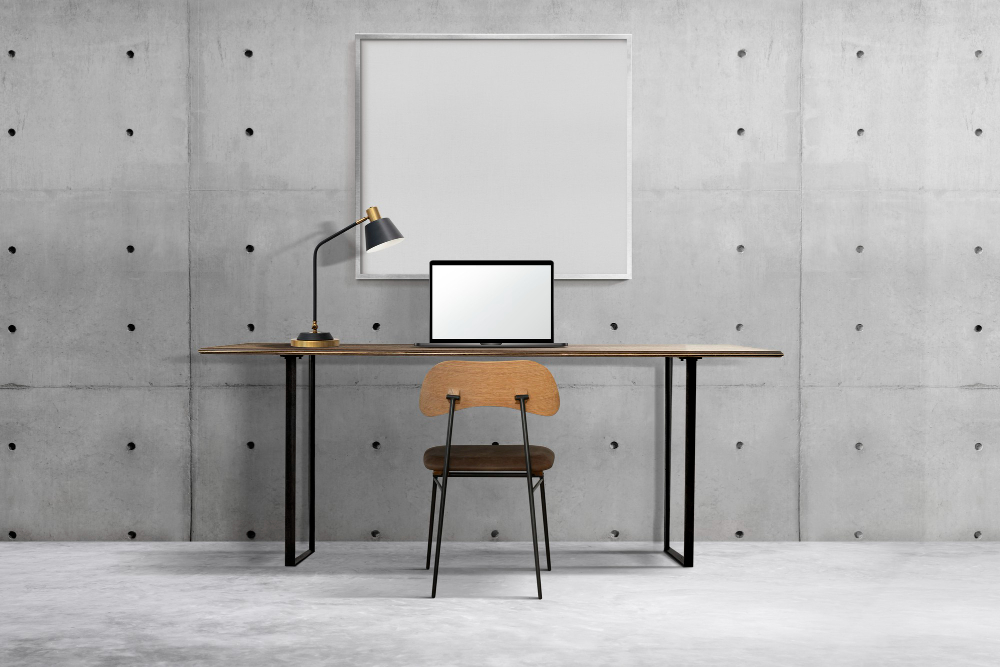 industrial-home-office-interior-design-with-white-frame-hanging-on-wall