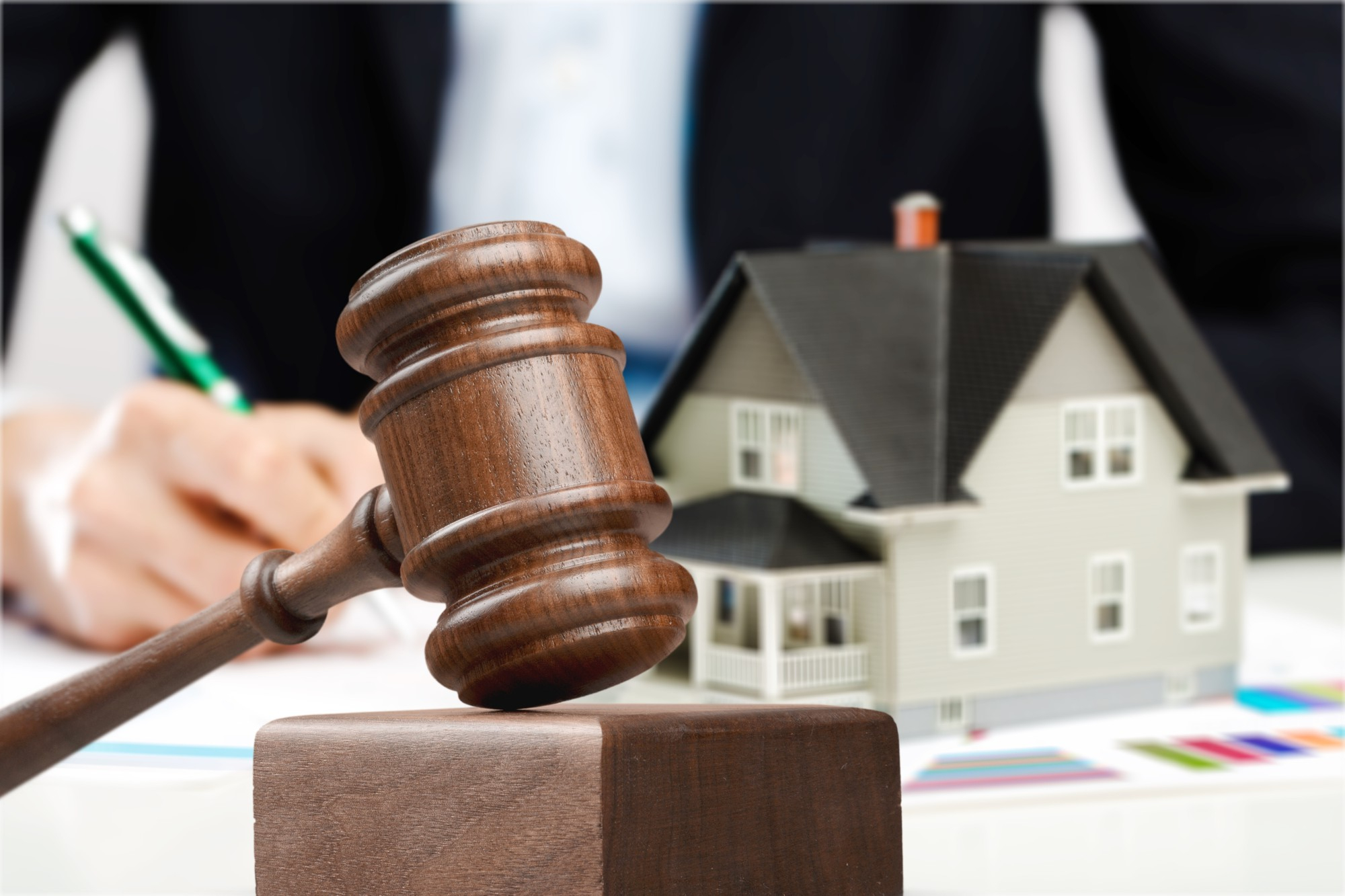 wooden-judge-gavel-and-toy-house